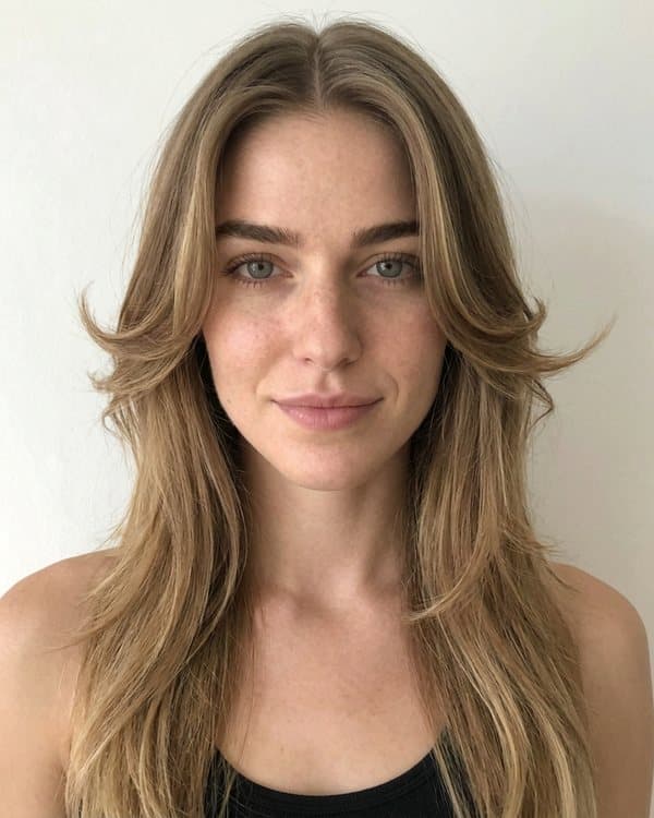 The same woman before and after a butterfly cut: after