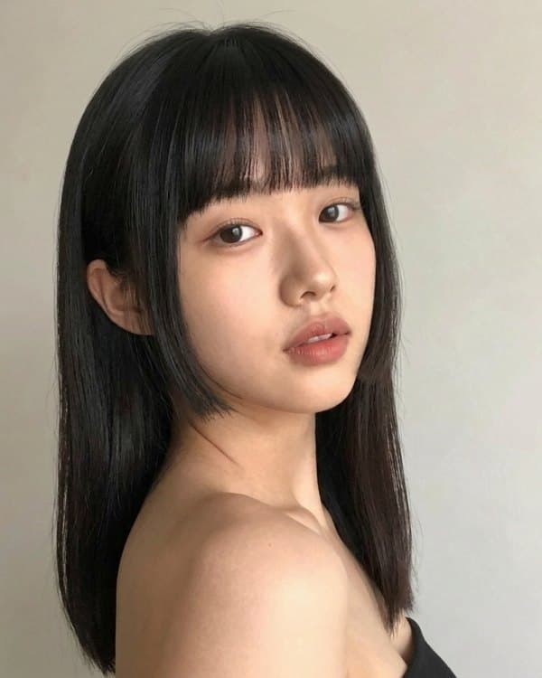 The same woman before and after a hime cut: after
